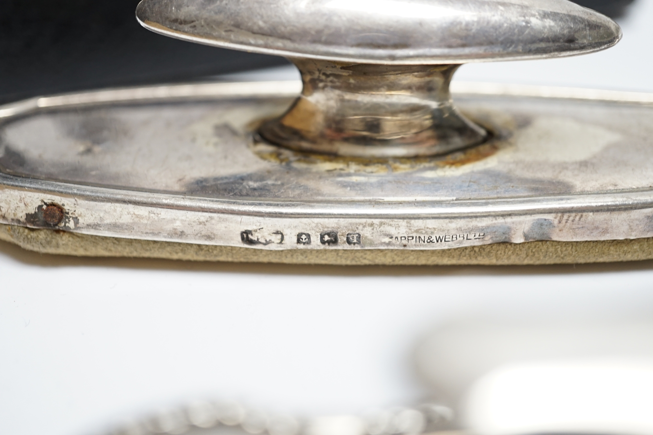 A cased silver christening egg cup and spoon and other items including nail buffers, inkwell, brushes etc.